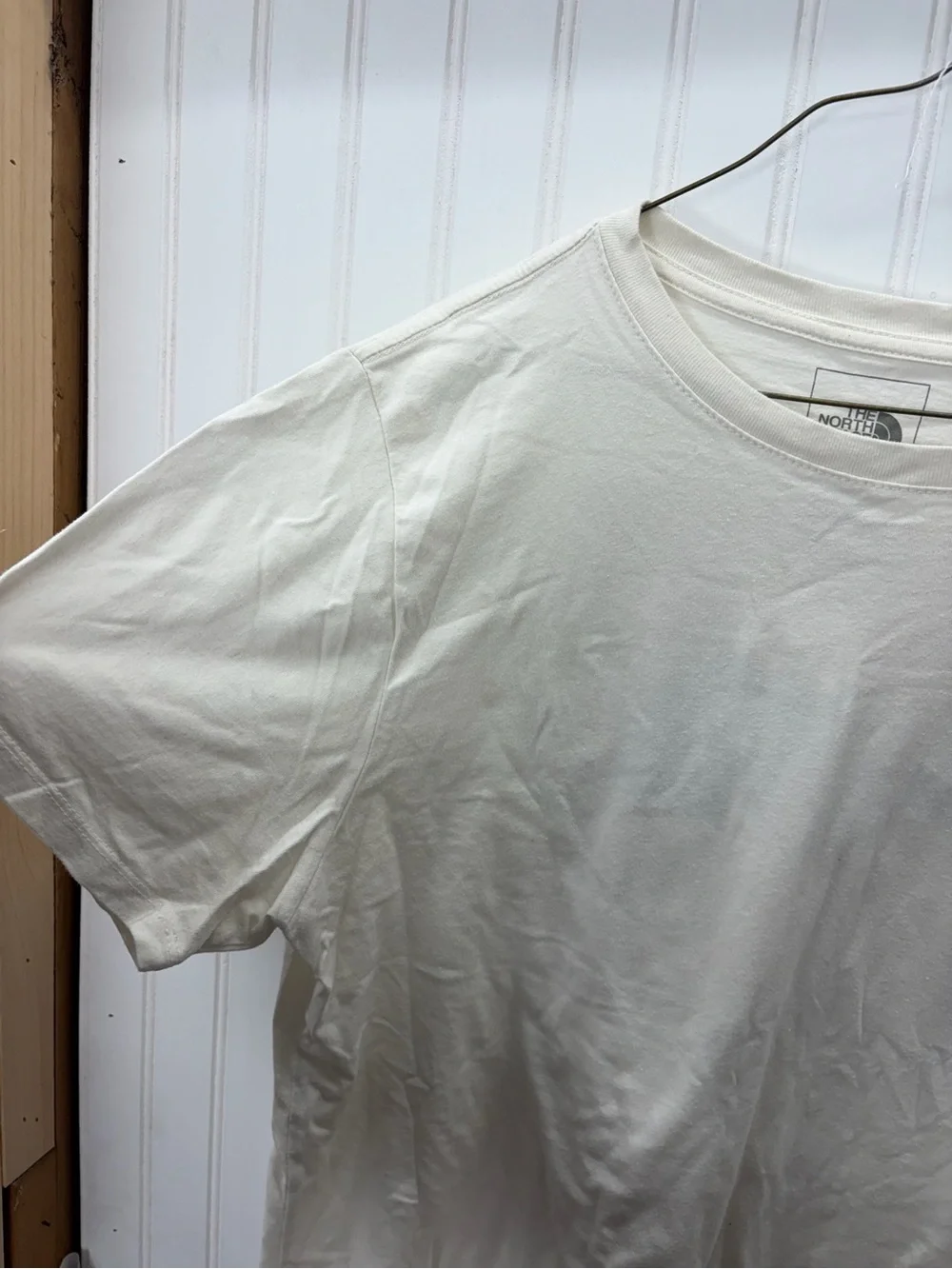 The North Face Men’s Cream Short-Sleeve Logo Tee with Black Chest Emblem